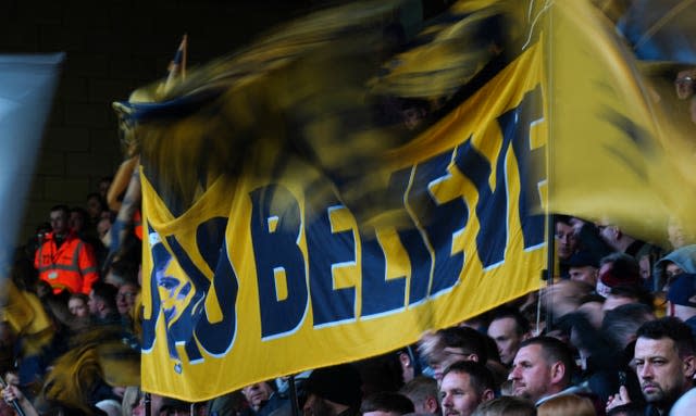 Wolves fans hold up a banner reading 'Joao Believe' in honour of midfielder Joao Moutinho