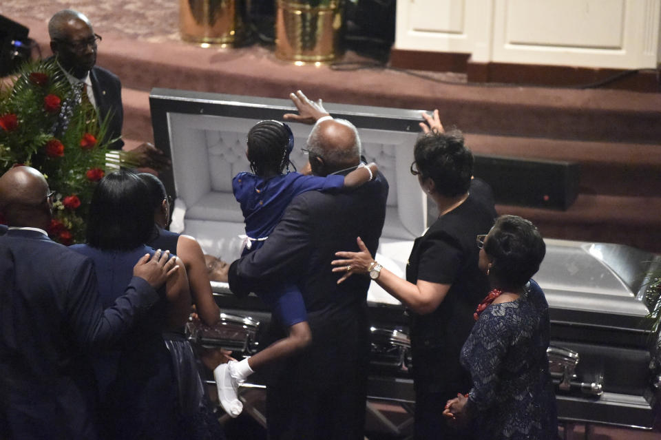 House Majority Whip Jim Clyburn and one of his granddaughters close the casket of his wife, Emily, during a funeral service on Sunday, Sept. 22, 2019, in West Columbia, S.C. (AP Photo/Meg Kinnard)