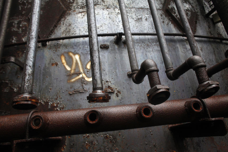 Pipes are seen in an abandoned steel melting furnace in Pittsburgh, Pennsylvania on April 8, 2011. The city is part of the American Midwest 