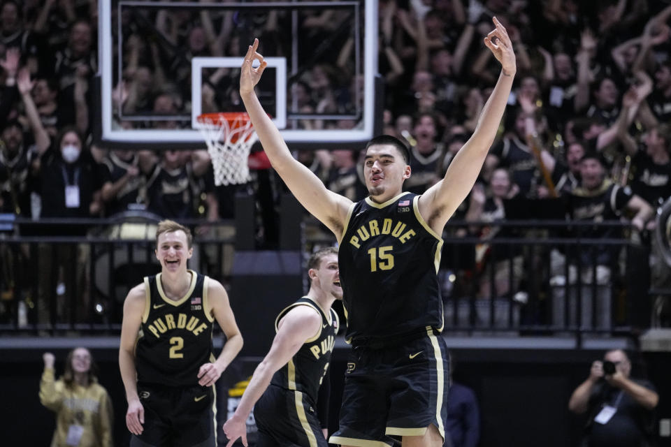 Purdue center Zach Edey (15) celebrates after hitting a three-point basket against Indiana during the second half of an NCAA college basketball game in West Lafayette, Ind., Saturday, Feb. 10, 2024. (AP Photo/Michael Conroy)