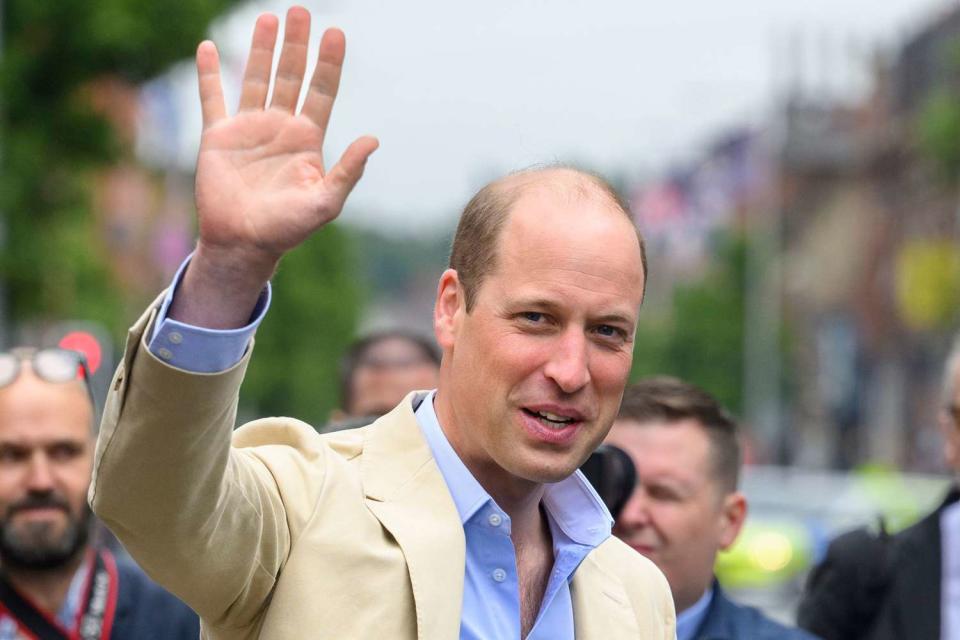 <p>Tim Rooke -Pool/Getty</p> Prince William, Prince of Wales waves as he visits the East Belfast Mission at the Skainos Centre as part of his tour of the UK to launch a project aimed at ending homelessness on June 27, 2023 in Belfast, United Kingdom. 