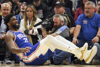 Philadelphia 76ers center Joel Embiid reacts to a call during the first half of an NBA basketball game against the Cleveland Cavaliers, Wednesday, Nov. 30, 2022, in Cleveland. (AP Photo/Nick Cammett)