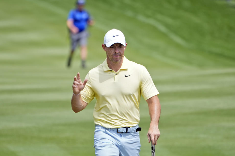 Rory McIlroy, of Northern Ireland, waves to the gallery as he walks onto the second green during the third round of The Players Championship golf tournament Saturday, March 16, 2024, in Ponte Vedra Beach, Fla. (AP Photo/Marta Lavandier)