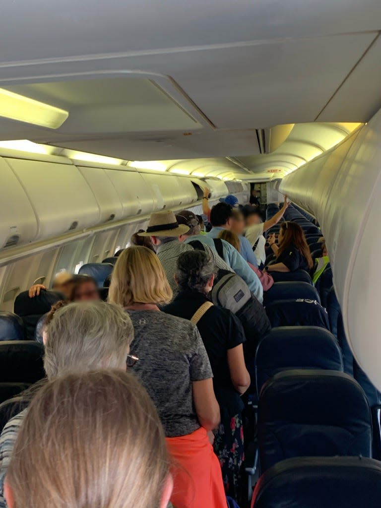 U.S. Citizens aboard a U.S. Immigration and Customs Enforcement jet used to deport undocumented immigrants. ICE was returning stranded Americans to the U.S. this week from Central America.