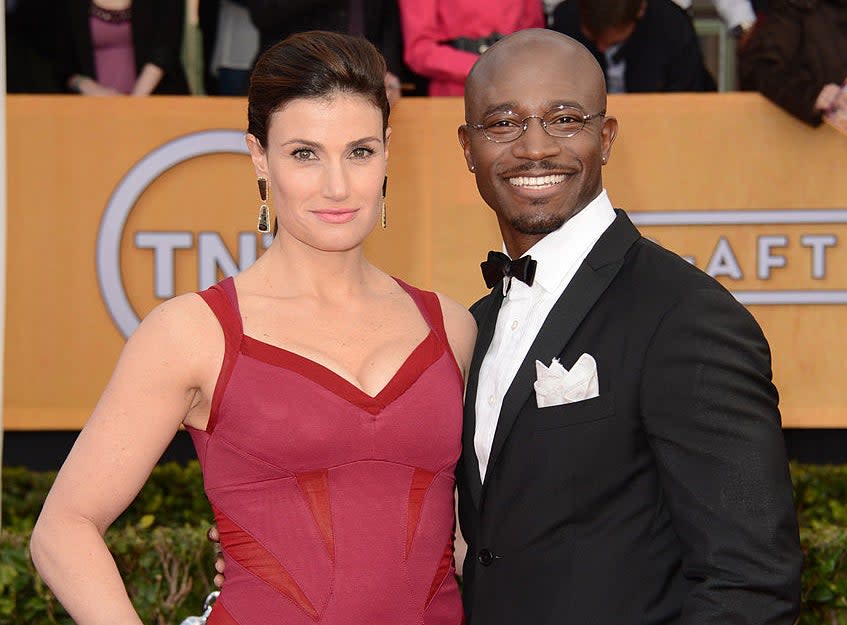 Close-up of Idina and Taye smiling at a media event