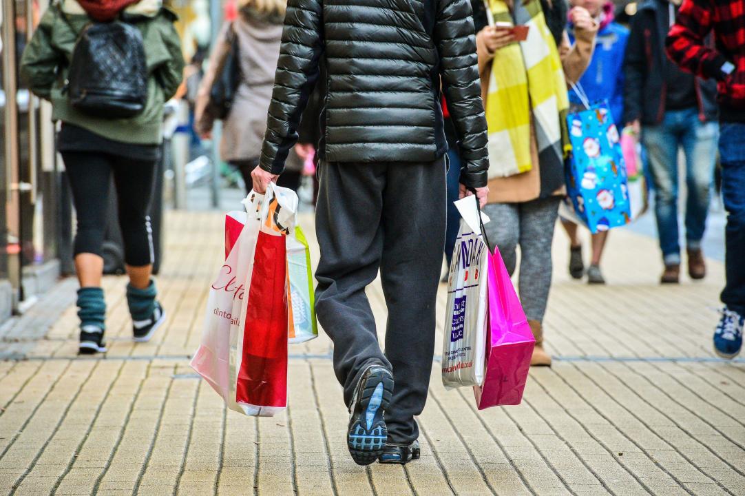 File photo dated 24/12/2016 of a man carrying bags in the Broadmead shopping area of Bristol. Retail sales improved in March, largely driven by an early Easter but providing a boost to firms after a difficult start to the year, figures suggest. Total UK retail sales were up by 3.5% on last March, above the three-month average of 2.1% and the 12-month average of 2.9%, according to the British Retail Consortium (BRC)-KPMG Retail Sales Monitor. Issue date: Tuesday April 9, 2024.