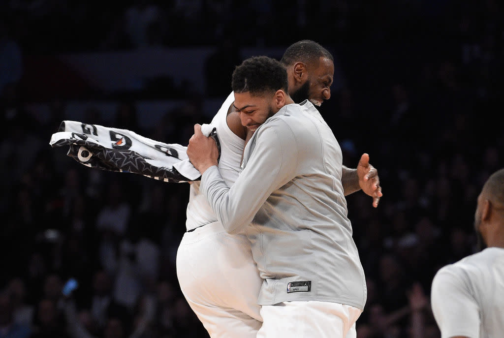 LeBron James and Anthony Davis share an embrace at the All-Star Game in February. (Getty Images)