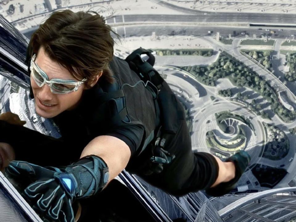 Tom Cruise hanging on the side of the Burj Khalifa in "Mission: Impossible - Ghost Protocol."