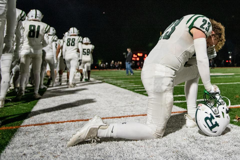 Northern Highlands hosts Ramapo in the North 1, Group 4 football title game in Allendale on Friday, Nov. 26, 2021. R #23 Dylan Snee takes some time to pray on the field prior to the game. This is the first game for Ramapo since the death of Coach Drew Gibbs.