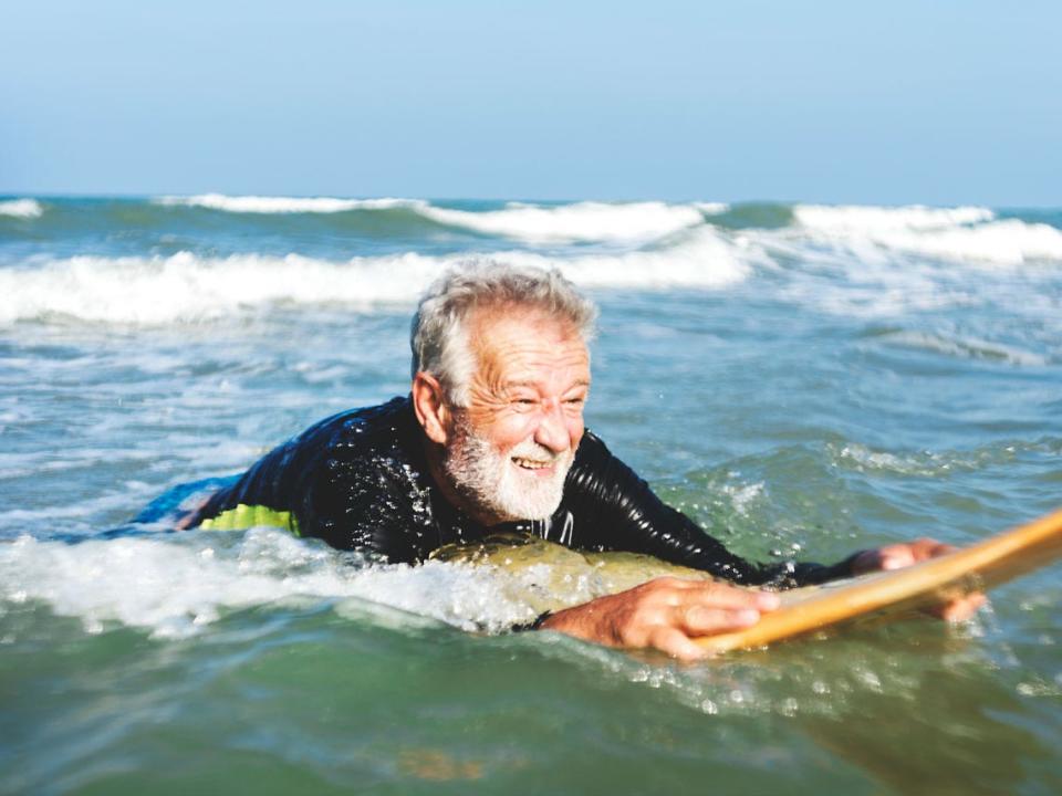 old man surfing