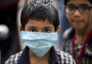 Wear a surgical mask at all times. The mask should be changed every 6-8 hours and disposed of. Disposable masks are never to be reused. Masks used by patients/care givers should be disinfected using ordinary bleach solution and then disposed of either by burning or deep burial. Used mask should be considered as potentially infected.