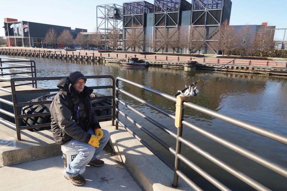 Charlie Kopling of South Milwaukee and an angler in a boat fish Dec. 14 in the Menomonee River in downtown Milwaukee. Anglers in much of Wisconsin have had to opt for open water fishing so far this winter as ice has been slow to develop on most lakes and rivers.