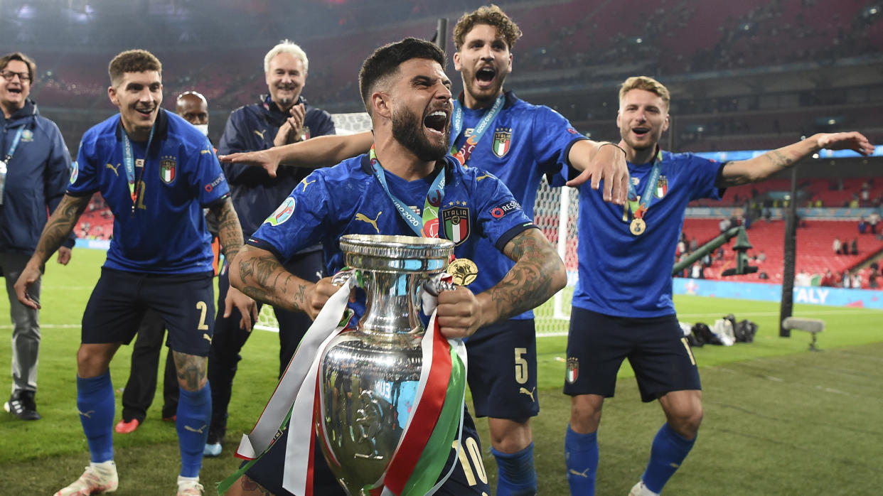 Italy's Lorenzo Insigne celebrates with the trophy after the final of the Euro 2020 soccer final match between England and Italy at Wembley stadium in London, Sunday, July 11, 2021. (Andy Rain/Pool Photo via AP)