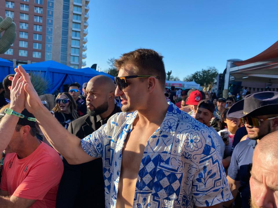 Rob Gronkowski high fives attendees at Gronk Beach.