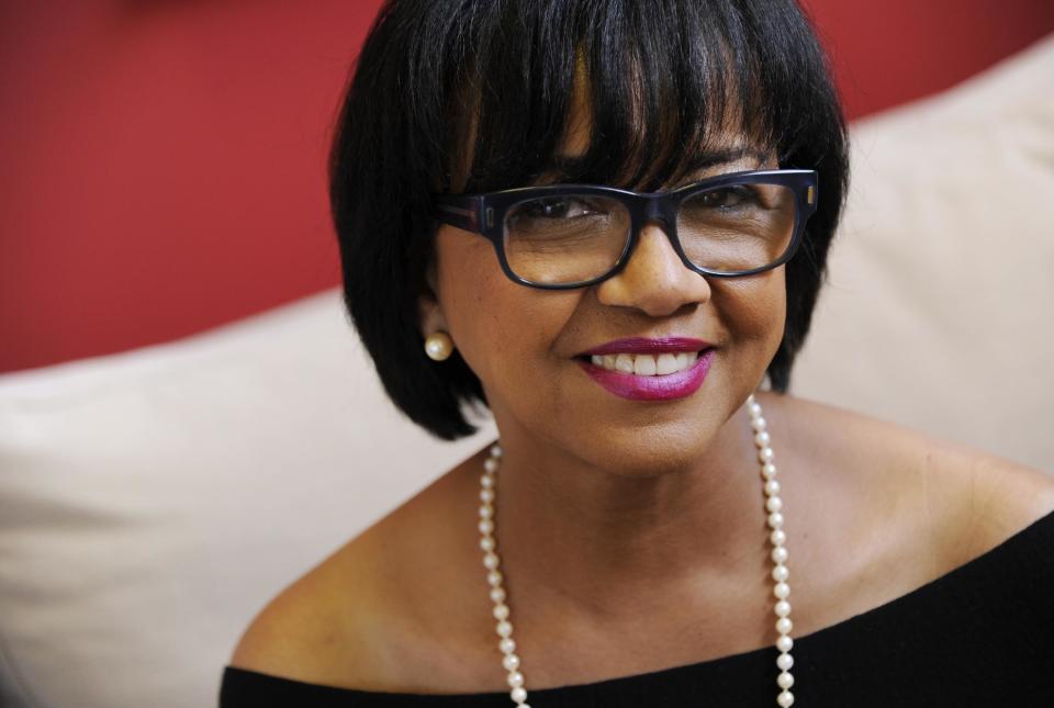 In this Wednesday, Feb. 19, 2014 photo, Cheryl Boone Isaacs, president of the Academy of Motion Picture Arts and Sciences, poses for a portrait in Los Angeles. Isaacs has become the third female Academy of Motion Picture Arts and Sciences president and the first ever African-American head of the organization. (Photo by Chris Pizzello/Invision/AP)