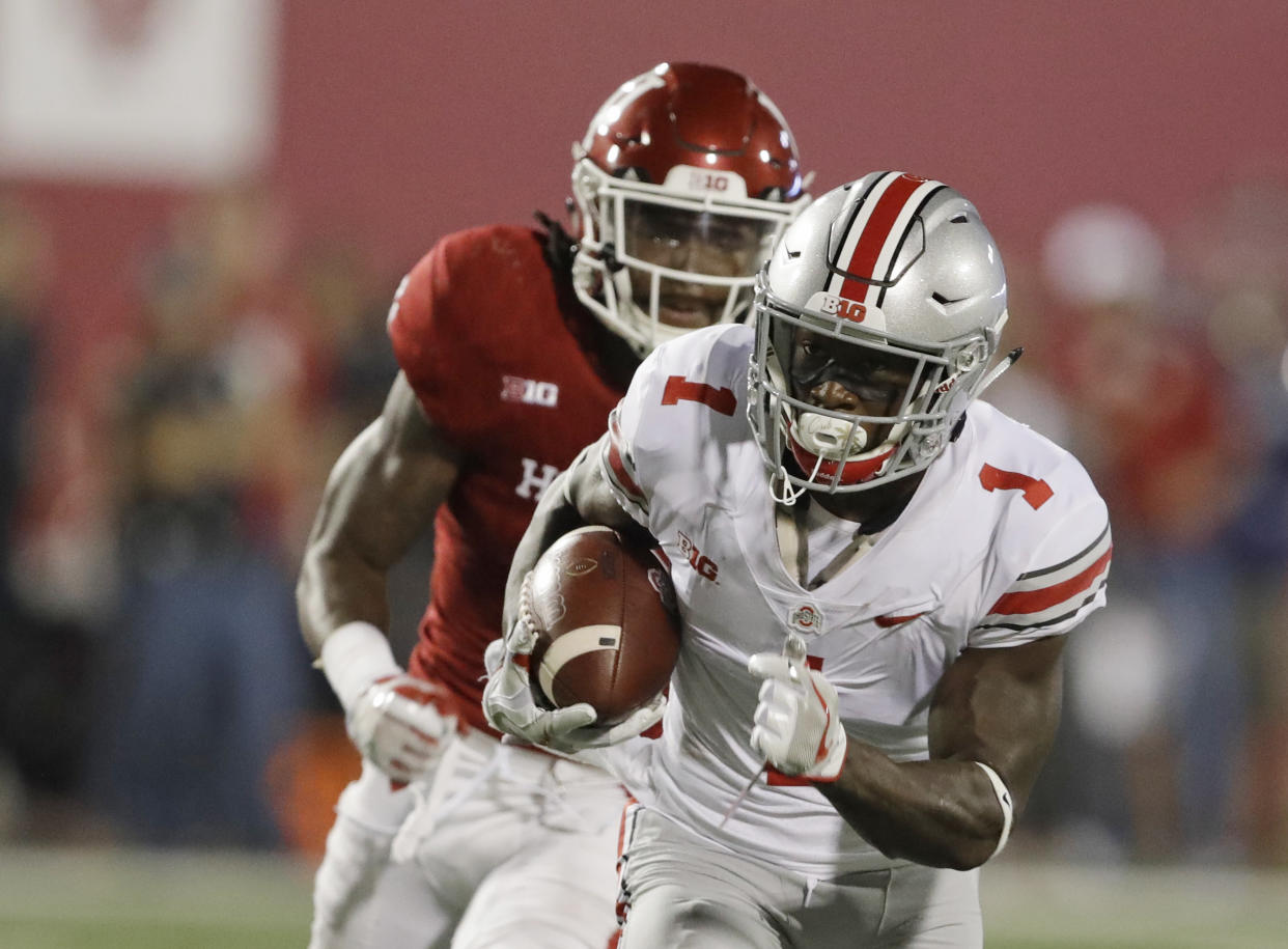 Ohio State wide receiver Johnnie Dixon runs past Indiana defensive back Jonathan Crawford for a 59-yard touchdown reception during the second half of an NCAA college football game Thursday, Aug. 31, 2017, in Bloomington, Ind. (AP Photo/Darron Cummings)