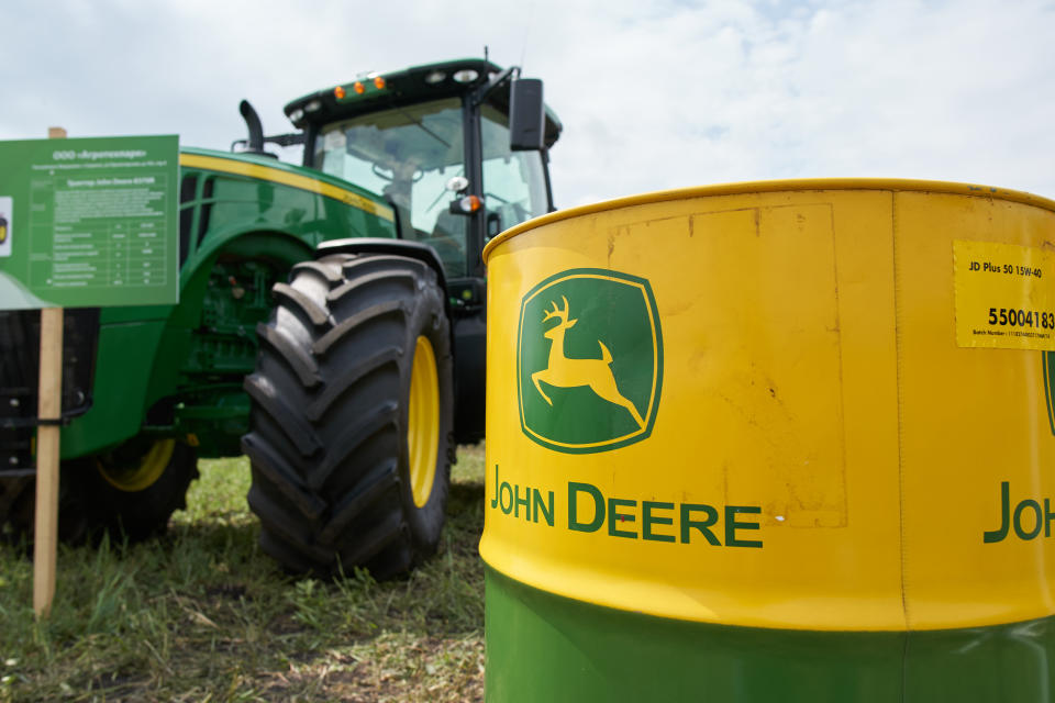 Goryainovka, Mordovia, Russia - June 28, 2019: The John Deere logo seen on JD Plus-50 15W-40 motor oil barrel.