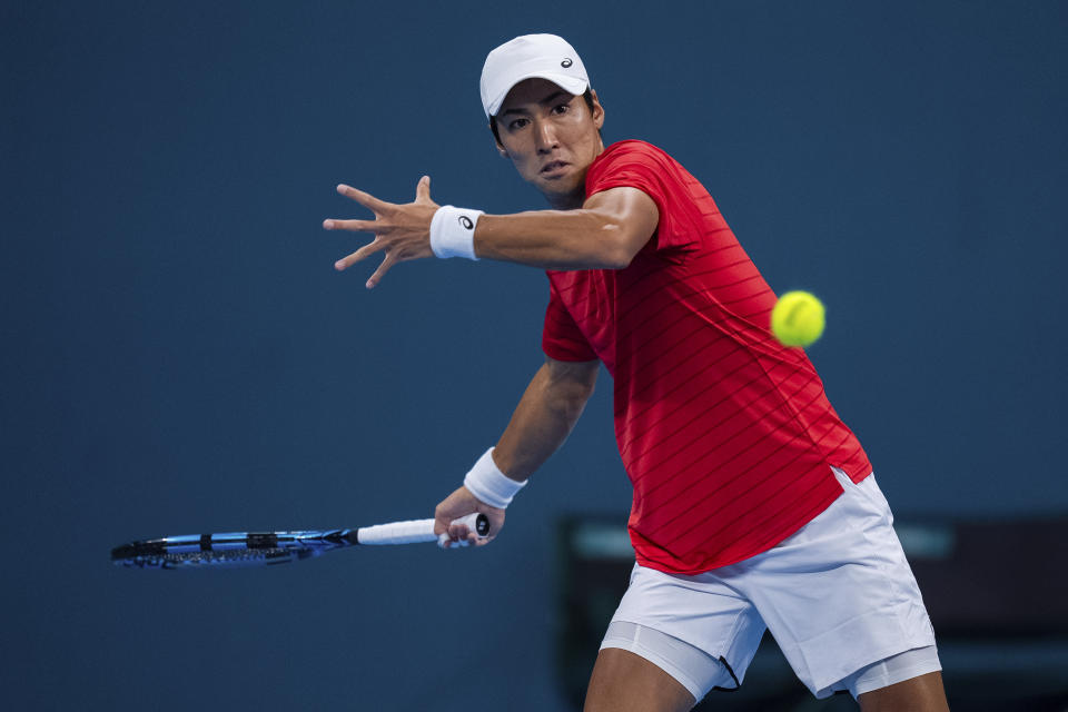 Japan's Watanuki Yosuke competes during the tennis men's singles final between China and Japan at the 19th Asian Games in Hangzhou, China, Saturday, Sept. 30, 2023. (AP Photo/Louise Delmotte)