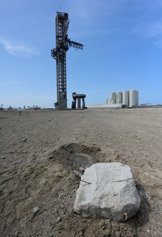 FILE PHOTO: A large piece of concrete is shown near SpaceX's launchpad after their next-generation Starship and super heavy rocket launched, causing damage at the company's Boca Chica facility, near Brownsville