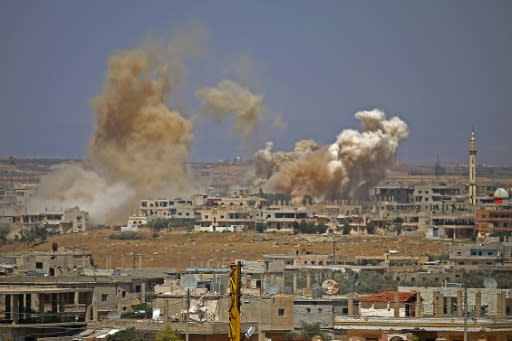 Smoke rises above rebel-held areas of Daraa city during airstrikes by Syrian regime forces on June 29, 2018