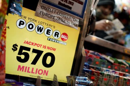 A vendor sells lottery tickets for the Powerball and Mega Millions draw at a news stand in midtown Manhattan in New York City, New York, U.S., January 5, 2018. REUTERS/Mike Segar