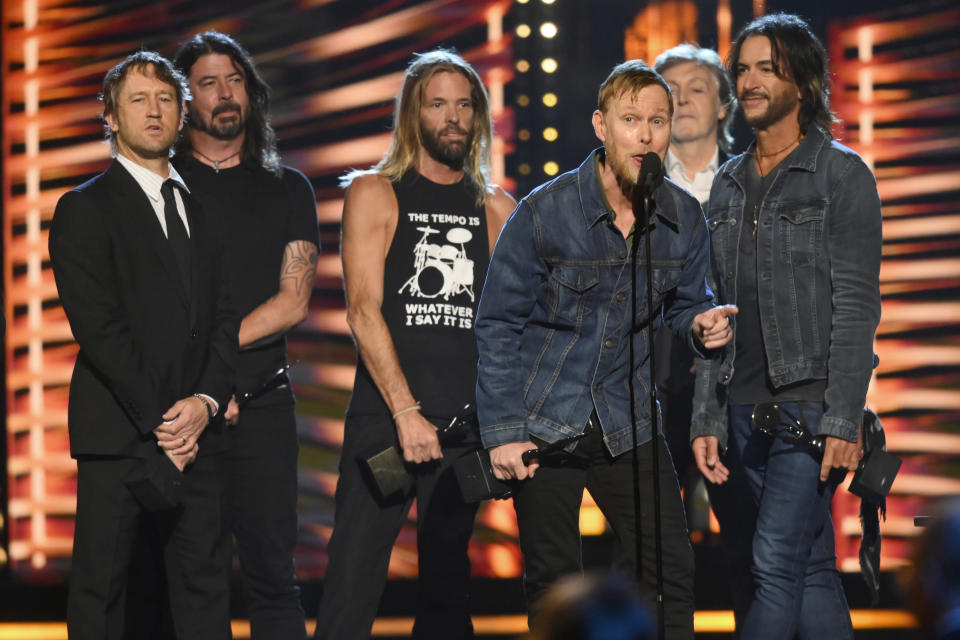 Nate Mendel, of the Foo Fighters, speaks during the Rock & Roll Hall of Fame induction ceremony, Sunday, Oct. 31, 2021, in Cleveland. The group were inducted as part of an eclectic 2021 Rock & Roll Hall of Fame class. (AP Photo/David Richard)