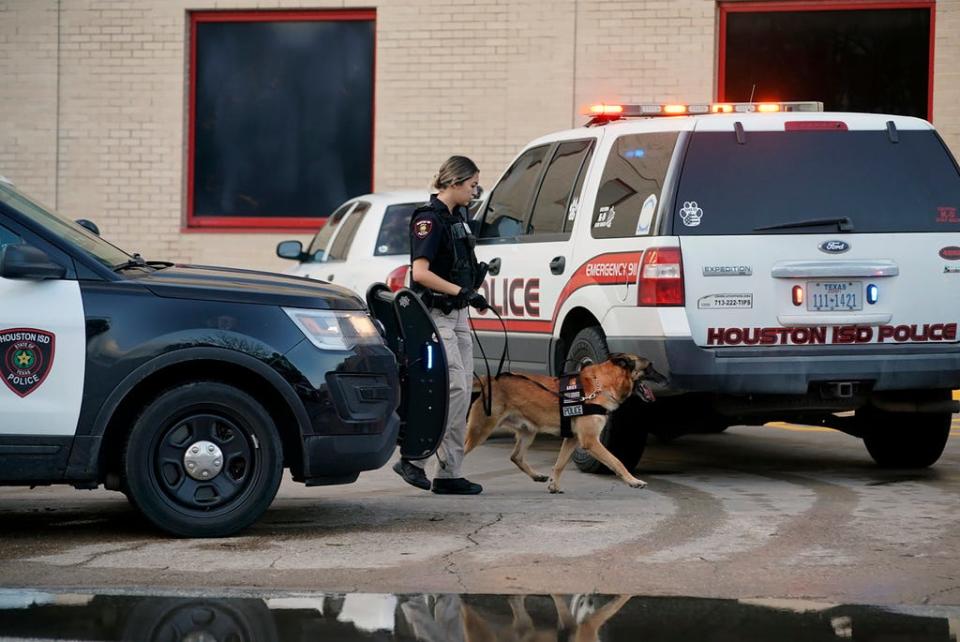 A Houston Independent School District Police K-9 unit responds to a shooting,  Jan. 14 at Bellaire High School in Bellaire, Texas.