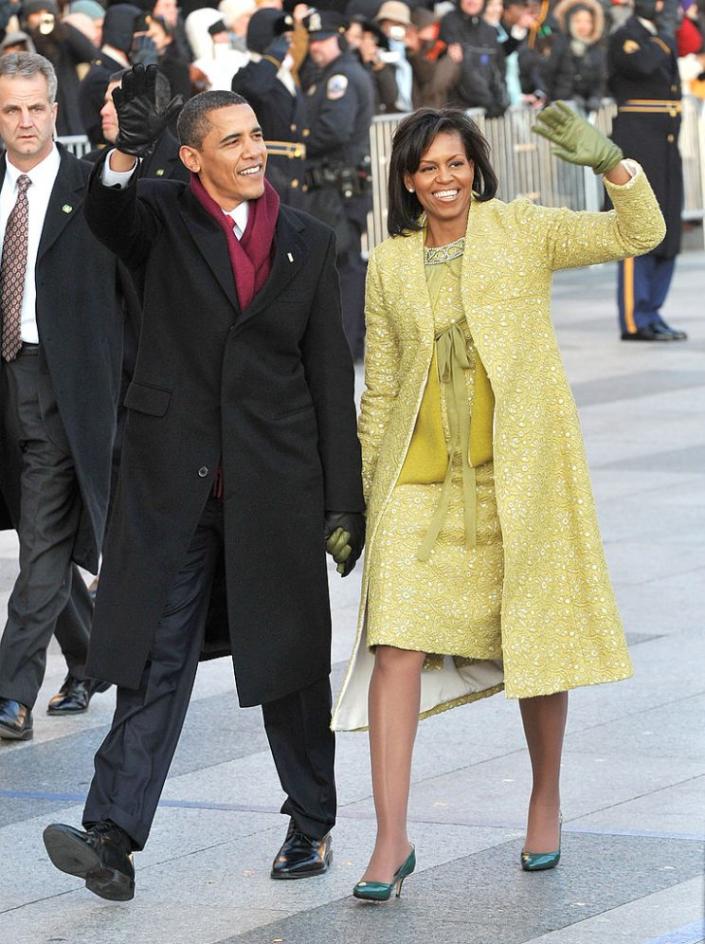 President Barack Obama and first lady Michelle Obama walk in the inaugural parade.