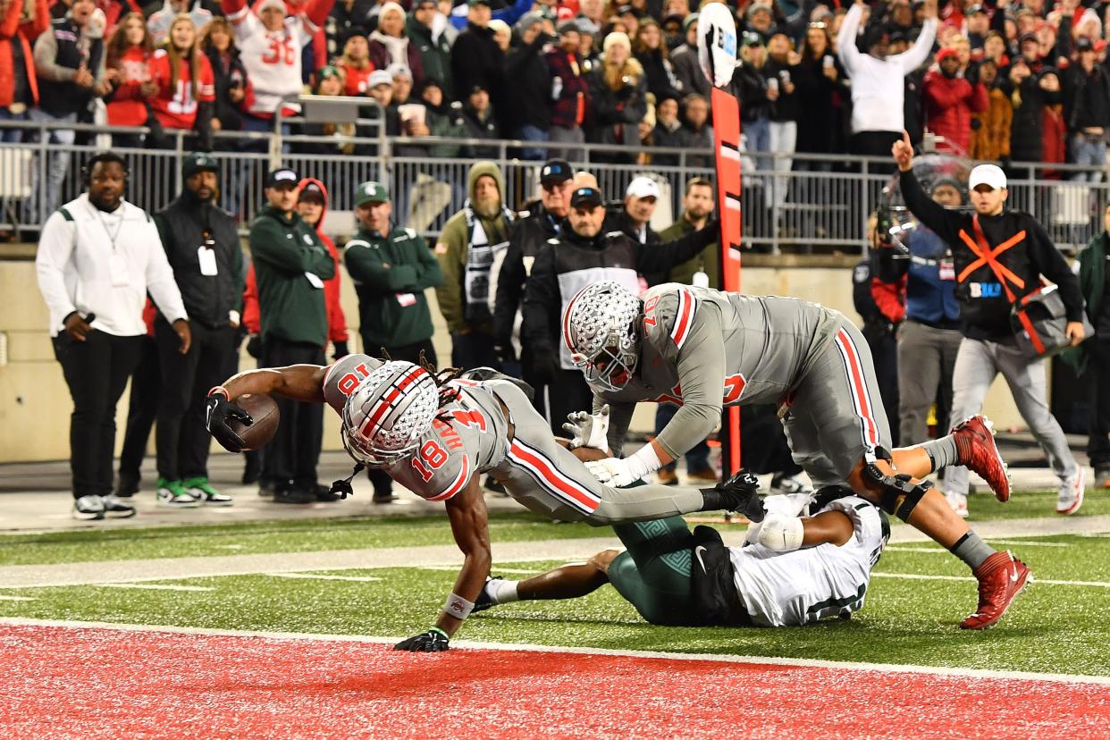 Marvin Harrison Jr. of the Ohio State Buckeyes scores a touchdown during the first quarter of a game against the Michigan State at Ohio Stadium in Columbus, Ohio, on Saturday, Nov. 11, 2023.