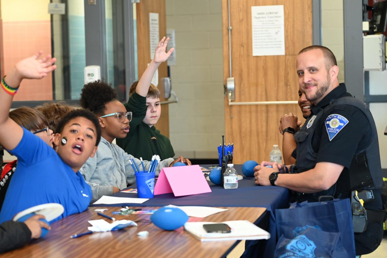 South Bend Police officer Joseph Cole talks with students about his experiences as a police officer on May 10, 2024 at 18645 Janet Drive.