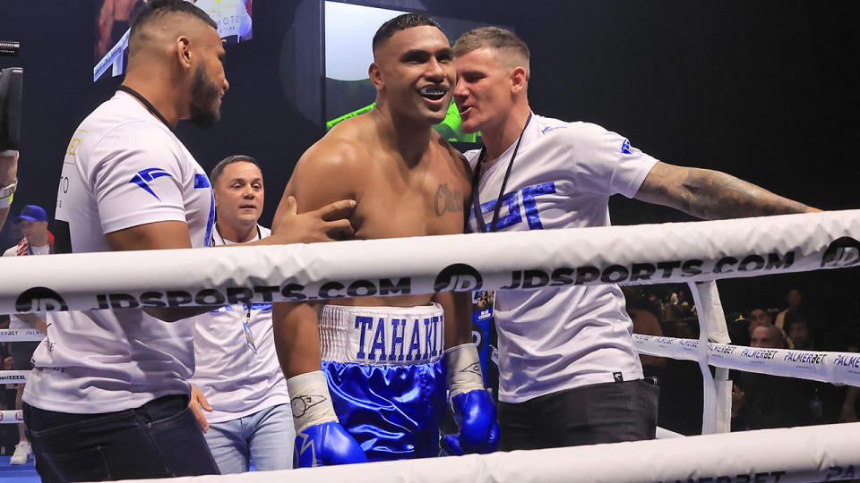 Tevita Pangai Junior celebrates after winning a boxing match.