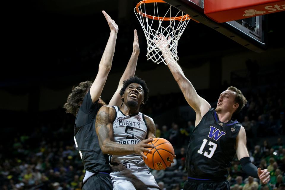 Oregon guard Jermaine Couisnard puts up a shot as the Oregon Ducks host the Washington Huskies Thursday, Feb. 8, 2024, at Matthew Knight Arena in Eugene, Ore.