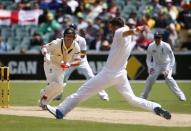 England's James Anderson (2nd R) fields a shot from Australia's David Warner (L) with his foot during the first day's play of the second Ashes test cricket match in Adelaide December 5, 2013.