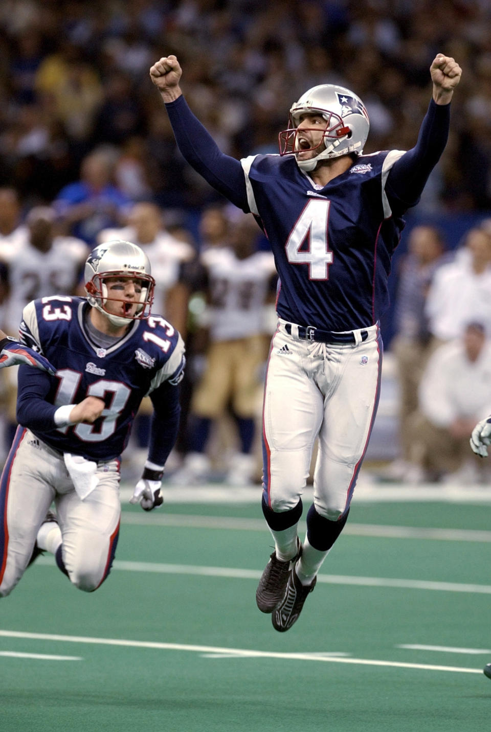 FILE - In this Feb. 3, 2002, file photo, New England Patriots kicker Adam Vinatieri celebrates after kicking the 48-yard, game-winning field goal in the final seconds of NFL football's Super Bowl 36 against the St. Louis Rams in New Orleans. The 48-year-old former Indianapolis Colts and Patriots star told former teammate and SiriusXM radio host Pat McAfee that he plans to retire. “By Friday, if paperwork goes in, you heard it here first,” Vinatieri said .(AP Photo/Amy Sancetta, File)