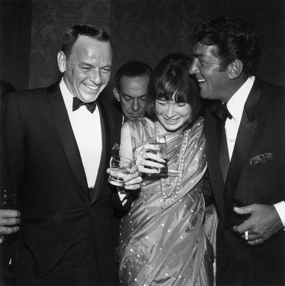 Frank Sinatra, Shirley MacLaine and Dean Martin spend a night out in 1965 Hollywood. (Photo: M. Garrett/Murray Garrett/Getty Images)