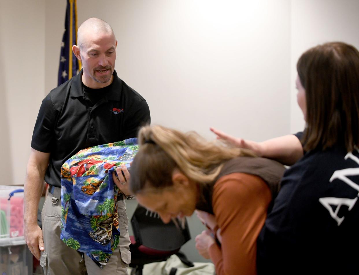 Randy Feesler, left, owner of The Pulse Provider, instructs a lifesaving class at the American Red Cross offices in Canton.