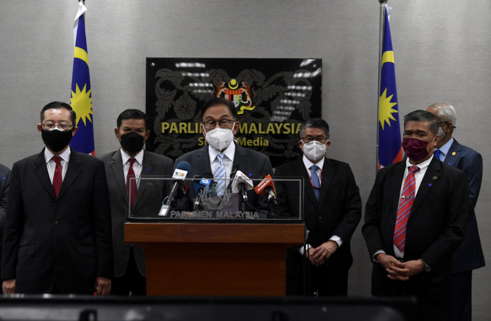 Opposition Leader Datuk Seri Anwar Ibrahim with Bagan MP Lim Guan Eng and Kota Raja MP Mohamad Sabu during a press conference in Parliament lobby, July 29, 2021. — Bernama pic