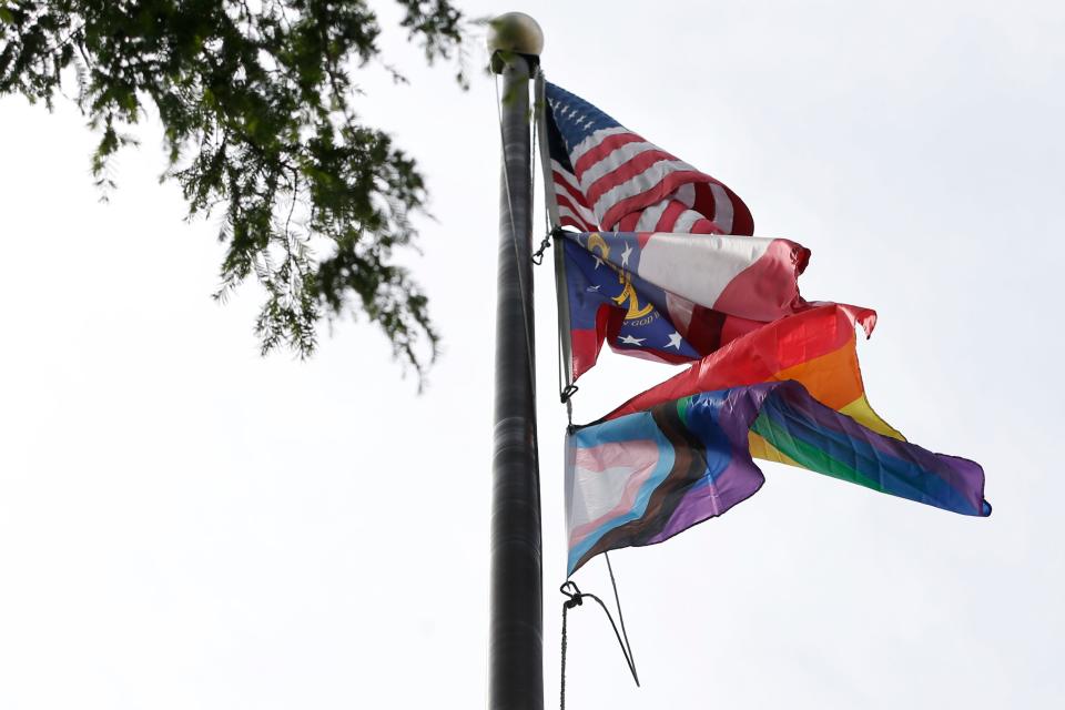 The Pride flag flies above city hall after a Pride flag rising ceremony to celebrate the start of Pride month in downtown Athens, Ga., on Thursday, June 1, 2023. The Pride flag will fly over Athens during Pride Month.
