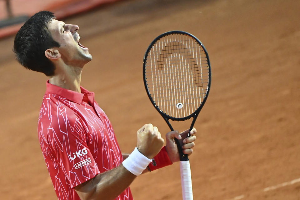 Serbia's Novak Đjoković celebrates winning his match with Argentina's Diego Sebastián Schwartzman during their final match at the Italian Open tennis tournament, in Rome, Monday, Sept. 21, 2020. (Alfredo Falcone/LaPresse via AP)