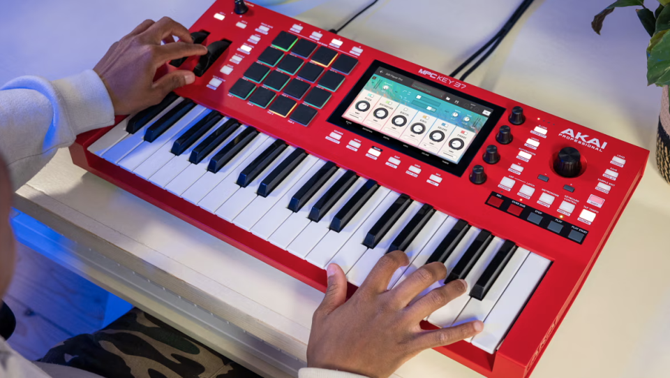 A pair of hands playing a keyboard. 