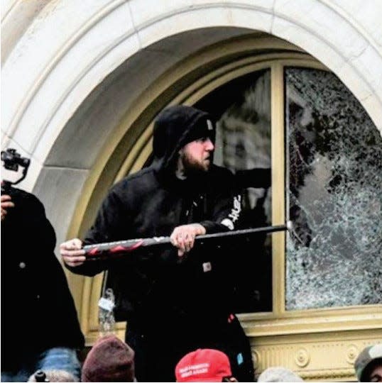 After talking to witnesses, the FBI alleges in a complaint that this photo shows Jordan Mink of Pennsylvania during the U.S. Capitol riot on Jan. 6, 2021.