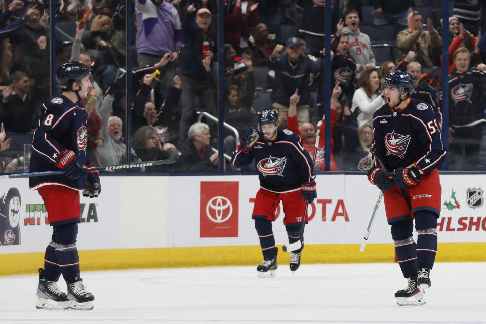 Columbus Blue Jackets' Yegor Chinakhov, right, celebrates his goal against the St. Louis Blues during the third period of an NHL hockey game Friday, Dec. 8, 2023, in Columbus, Ohio. (AP Photo/Jay LaPrete)
