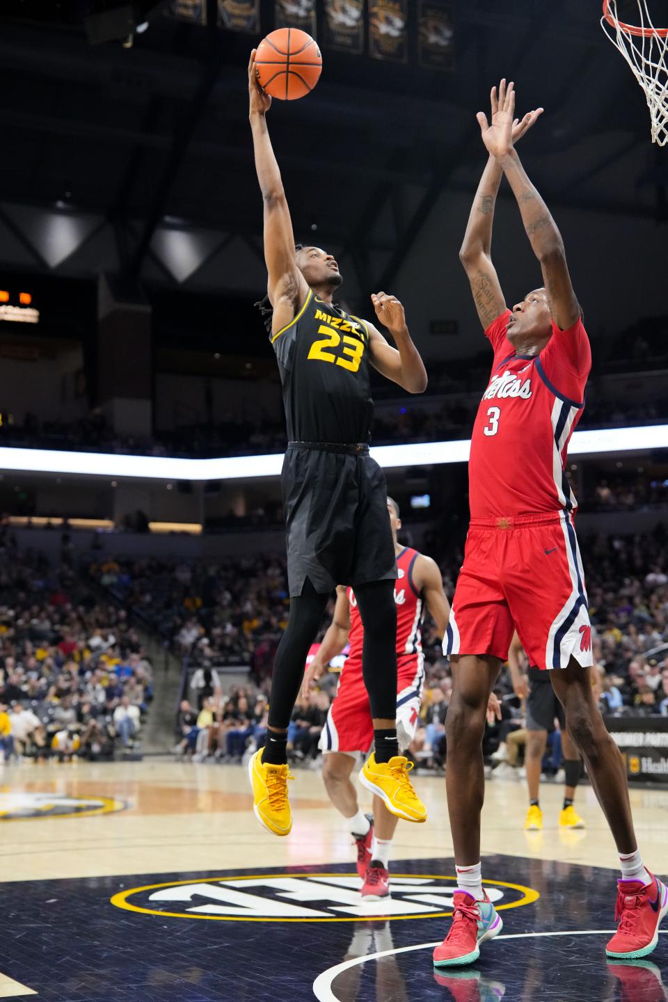 Mar 2, 2024; Columbia, Missouri, USA; Missouri Tigers forward Aidan Shaw (23) shoots as Mississippi Rebels forward Jamarion Sharp (3) defends during the first half at Mizzou Arena. Mandatory Credit: Denny Medley-USA TODAY Sports