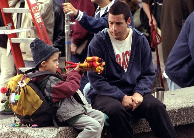 <p>Richard Corkery/NY Daily News Archive via Getty</p> Adam Sandler during filming of 'Big Daddy'