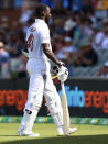 The West Indies' Anderson Phillip walks off after he was run out by Australia on the third day of their cricket test match in Adelaide, Saturday, Nov. 10, 2022. (AP Photo/James Elsby)