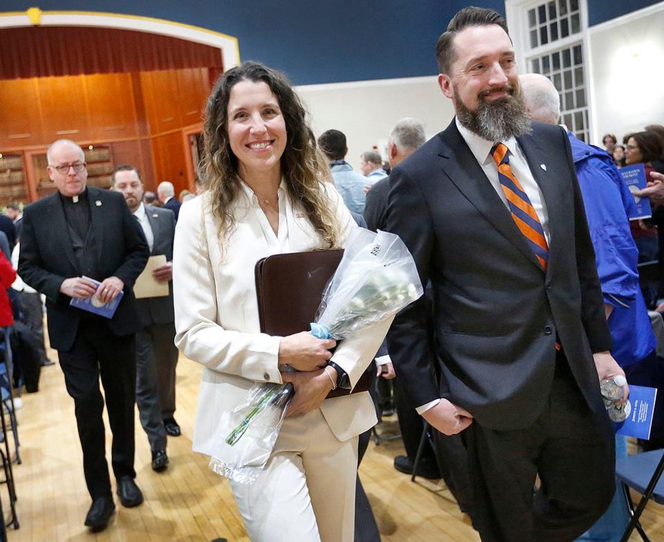 Mayor Erin Joyce and her husband, Michael, walk to a reception for residents after her swearing-in ceremony Tuesday, Jan. 2, 2024, at town hall.