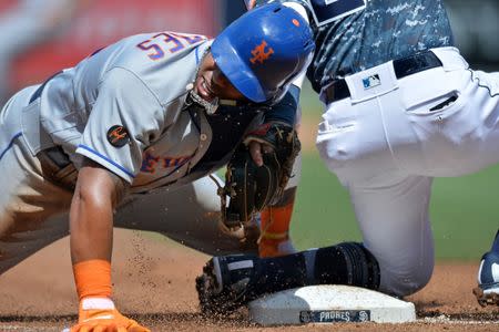 Apr 29, 2018; San Diego, CA, USA; New York Mets left fielder Yoenis Cespedes (left) slides safely into third with a stolen base as San Diego Padres third baseman Christian Villanueva applies the tag during the third inning at Petco Park. Mandatory Credit: Jake Roth-USA TODAY Sports