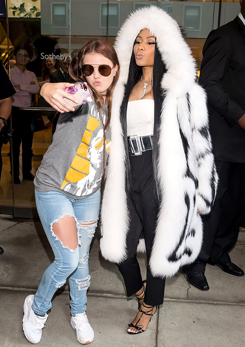 <p>Don’t expect to take a boring selfie with Minaj. The rapper was happy to pucker up with a fan as she left the Oscar de la Renta show at New York Fashion Week. (Photo: Gilbert Carrasquillo/GC Images) </p>