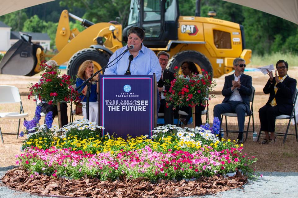 Ashley Edwards, director of parks, recreation and neighborhood affairs, welcomes a large crowd to a groundbreaking ceremony for the new Senior Center on Wednesday, May 1, 2024.