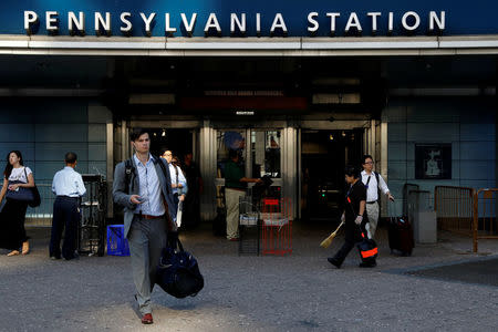 Commuters exit New York's Pennsylvania Station which began track repairs causing massive disruptions to commuters in New York City, U.S., July 10, 2017. REUTERS/Brendan McDermid